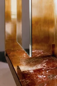 Modern console table made of marble and metal