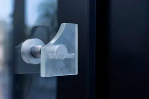 A glass door handle with the text 'GOTODAY'.