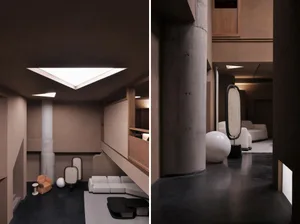 A modern interior living room with exposed concrete and wooden elements, featuring a unique lighting fixture and contemporary