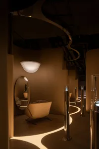 Modern interior space with illuminated glass elements and lighting