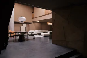 Modern living room with concrete flooring and minimalist design