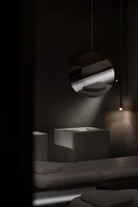 A modern medical office with a minimalist design featuring white furniture and neutral-colored walls.