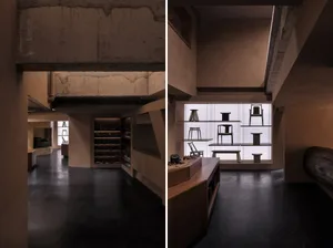 現代零售店內混凝土牆面與展示各種物品的層架。