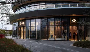 Modern retail storefront with glass, brick and metal material.