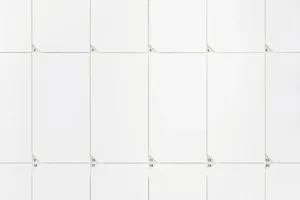A modern calendar with a white paper design and a grid layout.