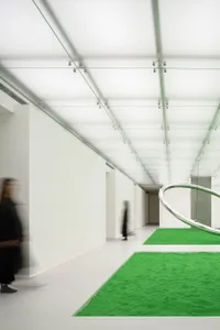 Blurred image of a modern minimalist interior with concrete walls and floors.