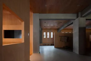 Industrial-style modern interior design featuring wooden and concrete materials.