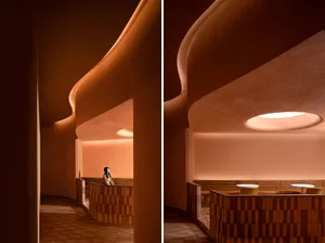 A modern coffee shop interior featuring a terrazzo design concept.