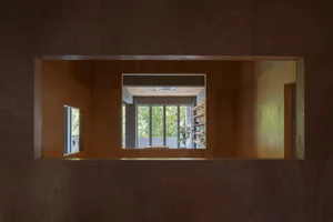 Modern interior space with minimalist design, featuring walls crafted from natural wood.