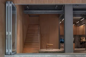 A modern retail storefront featuring wooden materials and a minimalist design.