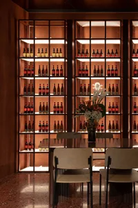 Industrial-style bar with metal shelves and glass bottles