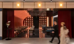 A modern restaurant interior with metallic textured walls