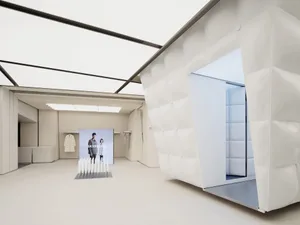 Minimalist design storefront with textile-covered walls and minimal decorations