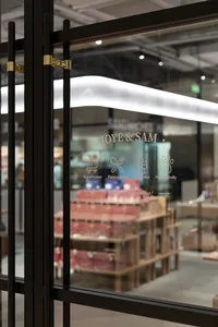 A glass door displaying the entrance to a restaurant bar