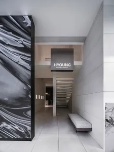 A modern spa entrance featuring concrete walls and a minimalist design.
