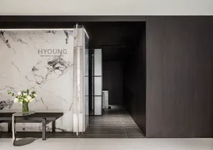 A modern spa entry featuring marble and steel materials.