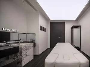 Modern interior design of a medi-spa featuring marble countertops and minimalist furniture.