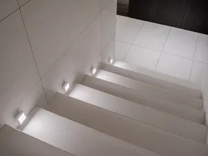 Modern staircase with LED lighting built into the steps and walls.