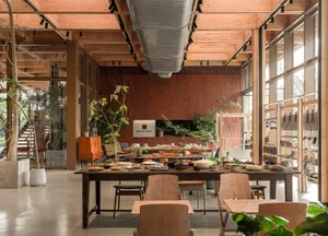 An industrial-style retail storefront featuring wooden materials and a spacious, open layout.