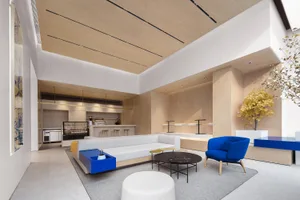 Modern living room with contemporary wooden furniture and walls.