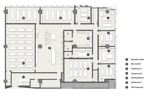 Floor plan of an educational institution featuring classrooms, dressing rooms, and a reception desk with concrete and steel c