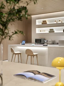 Modern design coffee shop featuring a terrazzo countertop and stools.