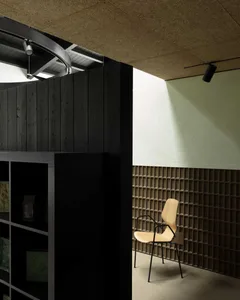 A minimalist office space featuring wooden furniture and metal accents.