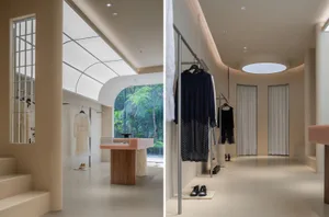 An image showcasing a modern retail shop with minimalist design elements, featuring concrete walls and floors.