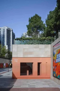 A modern retail storefront featuring natural materials and concrete walls.