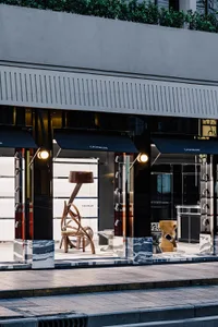 Modern retail storefront with glass, metal, and wood materials