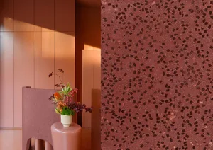 Modern lounge area with terrazzo floor and minimalist design elements.