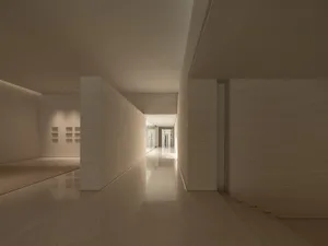 極簡室內空間，搭配白磚牆與混凝土地板。