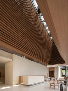 Lobby interior featuring a modern design with wooden laminate flooring.