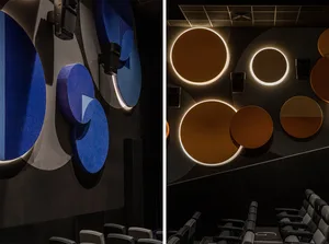 A cinema auditorium with acoustic tiles and lighting hardware