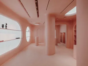 Modern minimalist interior space featuring curved concrete structures and a geometric layout.