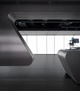 A modern office space with black interiors and a sleek, minimalist design.