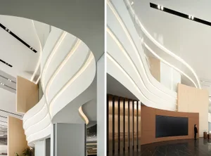 A modern office space featuring wood, glass, and metal materials.