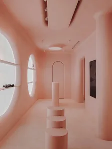 A modern interior space with smooth concrete walls and a sleek, minimalist design.