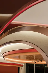 Modern interior ceiling featuring metallic and glass elements