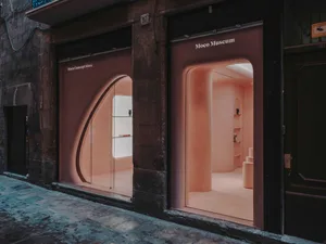 Modern glass storefront of a museum shop