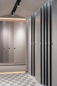 Modern, minimalist retail store interior with concrete walls and floors.