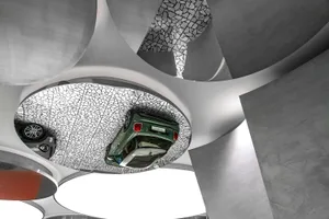 Modern car showroom ceiling design featuring a concrete structure and a green car on display.