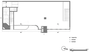 A minimalist floor plan, predominantly white with a single dark square element in the center.