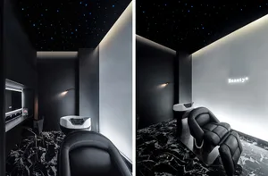 Contemporary office space with black, white, and gray color scheme, featuring sleek furniture and minimalistic decor.