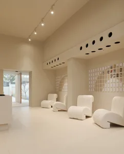 A retail storefront featuring neutral colors and minimalist design.