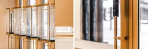 Glass display cases in a retail storefront showcasing elegant jewelry.