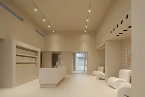 Modern retail shop interior with minimalist design and neutral color palette