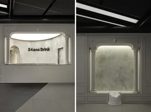 Modern bar interior with concrete walls and lighting, designed for an elegant and sophisticated atmosphere.