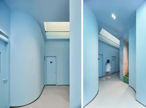 Modern interior design featuring minimalist aesthetic with concrete walls and floor.