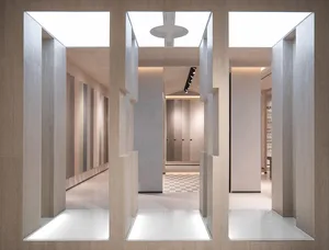 A modern retail space featuring glass and marble elements.